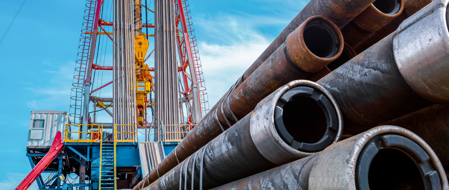 Large pipes in front of an offshore rig